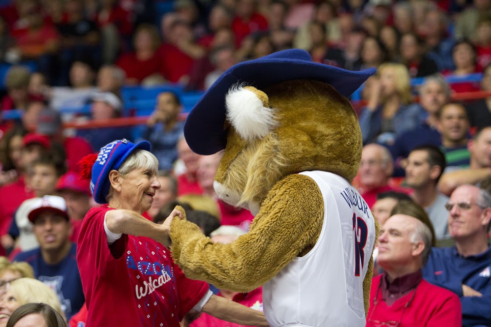 Arizona fan Phyllis Goodman dances with the Wilbur T. Wildcat during the UA’s 72-51 victory against UTEP at the McKale Center on Nov. 15, 2012 in Tucson, Ariz. Goodman, known as “Grandma” to Wildcat fans has been an Arizona season ticket holder for 45 years. Photo courtesy of Tyler Besh.